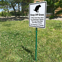 Dogs keep off of grass sign