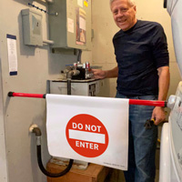 Warning sign for door barricade